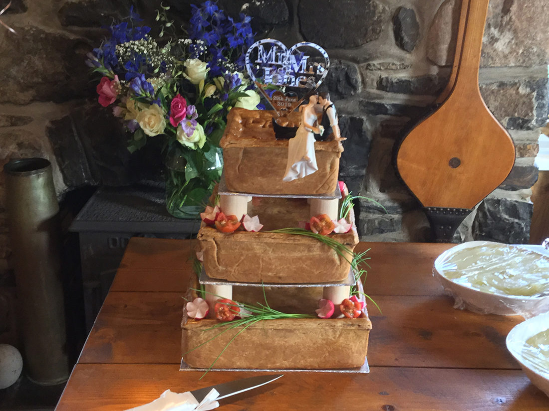 Tiered pork-pie wedding centrepiece